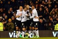 Fulham's Dimitar Berbatov (C) celebrates after scoring during their Premier League match against QPR on April 1, 2013